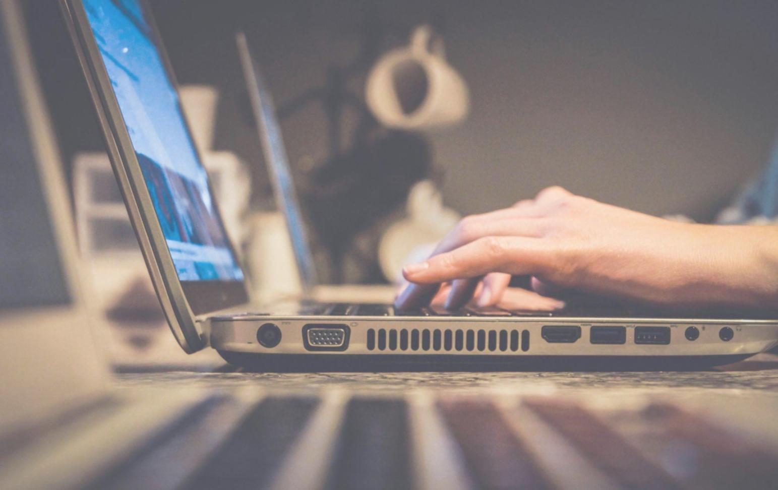 Person working on laptop with SEO tools visible